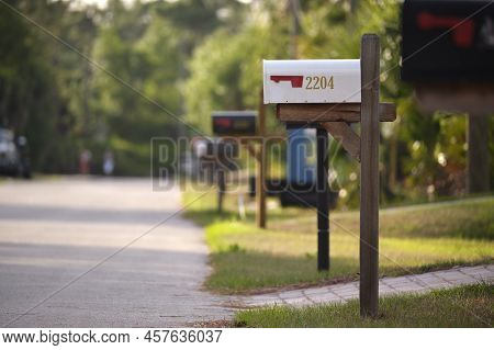 Typical American Outdoors Mail Box On Suburban Street Side