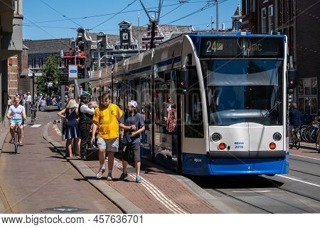 Amsterdam, The Netherlands - 21 June 2022: Gvb Tram On Damrak Street