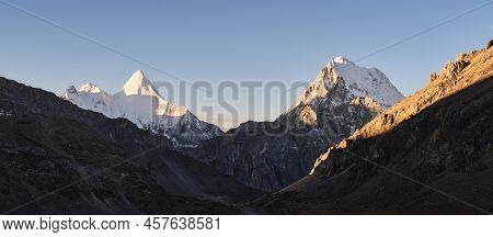Mount Jampayang And Mount Chanadorje At Sunrise In Yading National Park, Daocheng County, Sichuan Pr