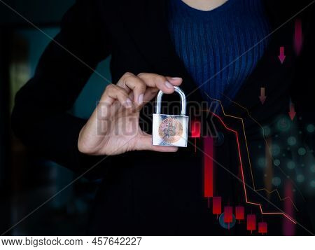 Staff Woman With Black Suit Holding Key With Bitcoin Crypto Currency Growth In Stock Market Down Tre
