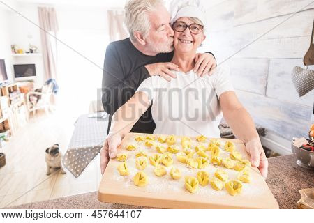 Happy Senior People Enjoying Home Indoor Activity Cooking Italian Tortellini Healthy Hand Made Pasta