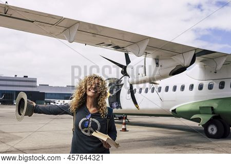 Happy Cheerful Traveler Woman Smile And Enjoy The Filght With Airplane To Go To Holiday Vacation Des