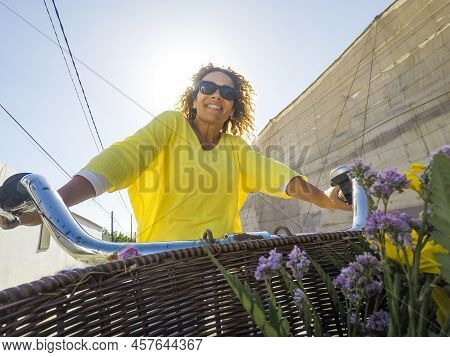 Happy Cheerful Young Adult Caucasian Beautiful Woman Ride The Bike And Enjoy The Outdoor Leisure Act