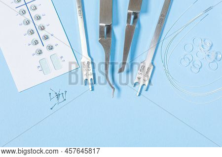 A Set Of Special Tools For An Orthodontist To Install Braces For A Patient. Orthodontic Arcs, Ligatu