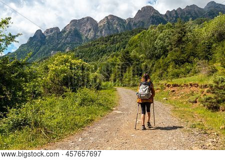 A Hiker On The Trek To The Piedrafita Arch In The Pyrenees In Panticosa, Aragon