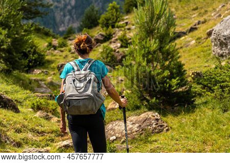 A Hiker On The Trek To The Piedrafita Arch In The Pyrenees In Panticosa, Aragon