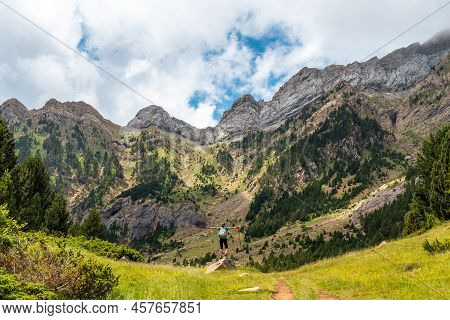 A Young Woman Climbing The Mountain To The Piedrafita Arch, Alto Gallego, Huesca, Aragon