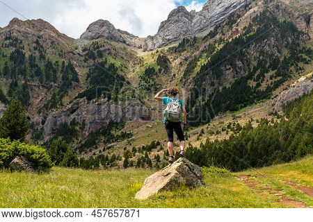 A Young Woman Climbing The Mountain To The Piedrafita Arch, Alto Gallego, Huesca, Aragon