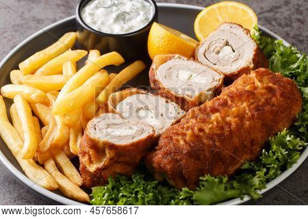 Serbian Breaded Rolled Cutlet Karageorge Schnitzel With French Fries And Tartar Sauce Close-up In A 