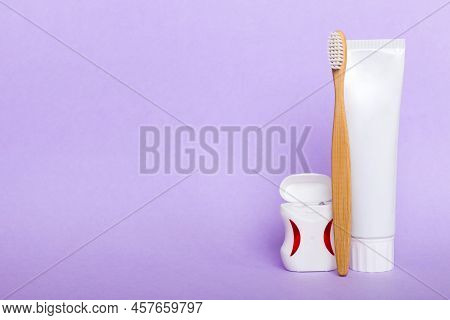 Toothpaste And Toothbrush Top View With Copy Space On Colored Background. Flat Lay. Dental Hygiene. 