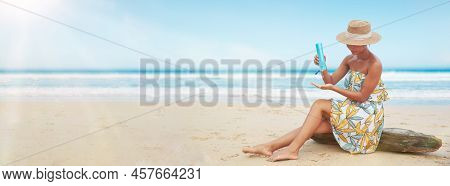 Woman Pouring Applying Sunblock Cream Lotion On Beach For Broad Spectrum Uva, Uvb Sun Protection