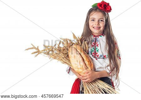 Portrait Of A Beautiful Girl Woman In Traditional Bulgarian Folklore Dress Holding Homemade Bread An