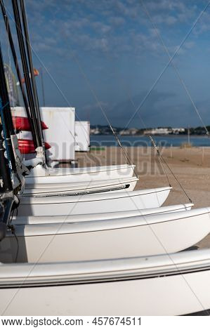 Boats On The Shore At Comarruga Beach In Tarragona, Spain.