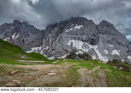 Mountain Hiking Trail Road. Grey Sky Before Thunderstorm. Between Italy And Austria: Near Volaia Lak
