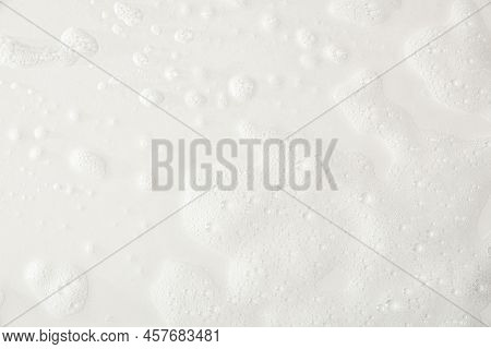 Foam Texture On A White Base With Traces Of Soap And Shower Water Detail. Top View. Horizontal Compo