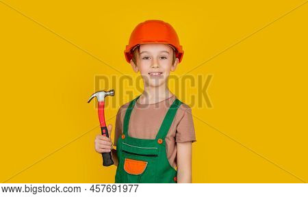 Child Dressed As A Workman Builder. Little Boy Wearing Helmet. Portrait Little Builder In Hardhats H