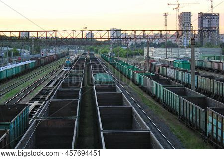 Trains And Freight Wagons On Railway Tracks. Terminal Railroad Flatcars Station Platform Of Cargo Co