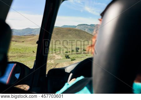A Panorama Of Beautiful Green Hills. A Summer Landscape In The Crimea. View From A Car, Driven By A 