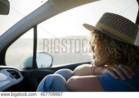 Portrait Of Woman Traveling Inside A Car And Thinking - Travel Lifestle People And Car Transport Con
