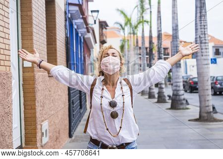 Happy Woman Celebrate The End Of The Pandemic Emergency For Covis-19 Coronavirus Opening Arms In The