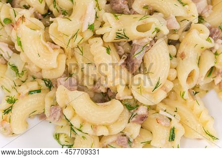 Boiled Short Curved Ruffled Pasta, So-called Creste Di Galli Or Rooster Comb, Mixed With Stewed Minc