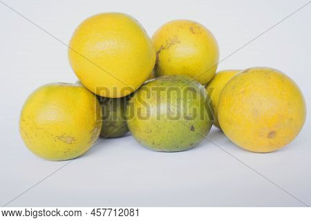 Fresh Lemon Slice, Orange Slice, Jeruk Baby, Citrus Sinensis, Green Lemon, Yellow Lemon In White Bac