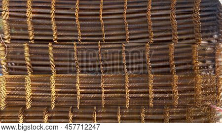 A Heap Of Wiremesh Steel Covering By Rust On The Cocrete Floor In Front The Building In Construction