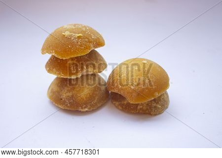 Brown Sugar Or Java Sugar Or Palm Sugar Or Gula Jawa Isolated On White Background. Top View. Flat La