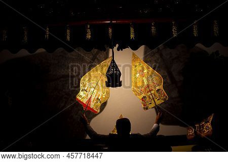 Wayang Kulit Or Shadow Puppets From Java, Indonesia Puppet Show By Dalang Or Puppeteer . Wayang Made