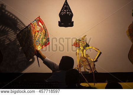 Wayang Kulit Or Shadow Puppets From Java, Indonesia Puppet Show By Dalang Or Puppeteer . Wayang Made