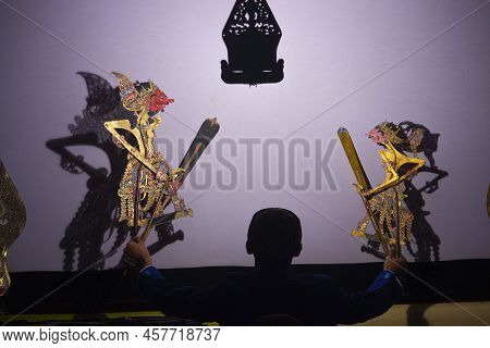 Wayang Kulit Or Shadow Puppets From Java, Indonesia Puppet Show By Dalang Or Puppeteer . Wayang Made