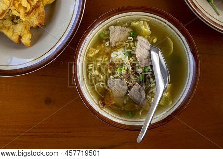Soto Sapi. Beef Soto From Indonesian Traditional Food From Boyolali In White Bowl And Black Wood Tab
