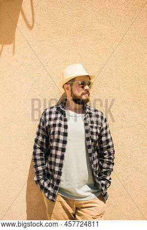 Fashion Millennial Stylish Man Posing On Streets Of European City. Bearded Handsome Hipster Man Posi