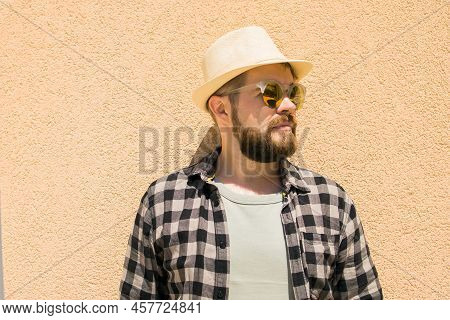 Fashion Millennial Stylish Man Posing On Streets Of European City. Bearded Handsome Hipster Man Posi