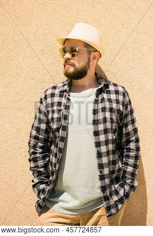 Fashion Millennial Stylish Man Posing On Streets Of European City. Bearded Handsome Hipster Man Posi