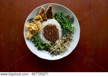 Nasi Pecel Or Sego Pecel Is Traditional Javanese Rice Dish Of Steamed Rice With Vegetable Salad, Pea