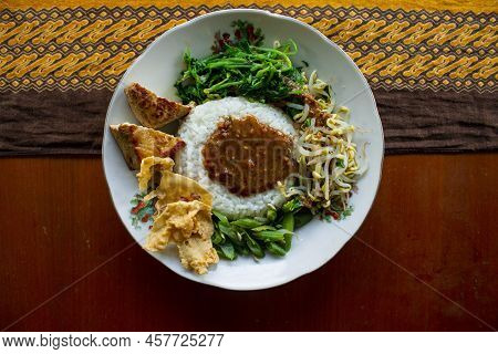 Nasi Pecel Or Sego Pecel Is Traditional Javanese Rice Dish Of Steamed Rice With Vegetable Salad, Pea