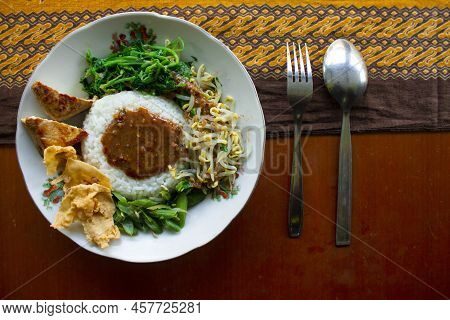 Nasi Pecel Or Sego Pecel Is Traditional Javanese Rice Dish Of Steamed Rice With Vegetable Salad, Pea