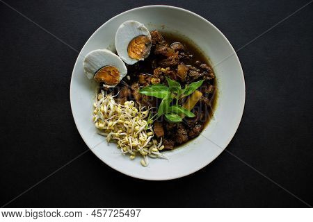 Rawon Or Nasi Rawon/rawon Rice Is Traditional Indonesian Beef Black Soup Served With Sprouts, Salted