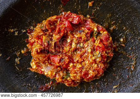 Fresh Sambal Served On Stone Mortar (cobek). Sambal Is Traditional Sauce From Indonesia Made From Ch