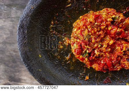 Fresh Sambal Served On Stone Mortar (cobek). Sambal Is Traditional Sauce From Indonesia Made From Ch
