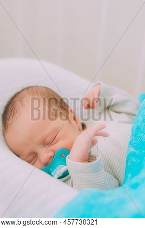 The Baby Is Lying In A Cocoon Of Copy Space . The Baby Is 0-3 Months Old. A Contented Infant. An Art