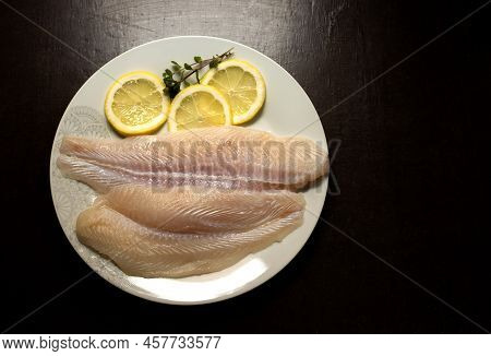 Panga Fillets, Pterogymnus Laniarius White Fish From Asia, Mild Flavor With Lemon Slices And Dark Ba