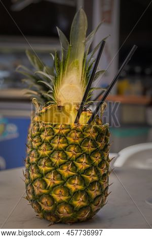 A Pinacolada Coctail In Fresh Pineapple Fruit On The Beachbar Table.