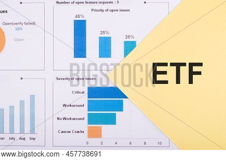 Etf. Exchance Traded Fund. Text On Yellow Paper On Financial Charts. Business Concept
