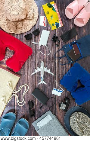 Man And Woman Pair Vacation Accessories On The Dark Wooden Boards. Travel Hats, Camera, Glasses, Tic