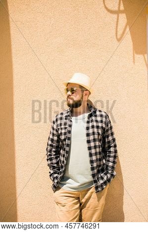 Fashion Millennial Stylish Man Posing On Streets Of European City. Bearded Handsome Hipster Man Posi