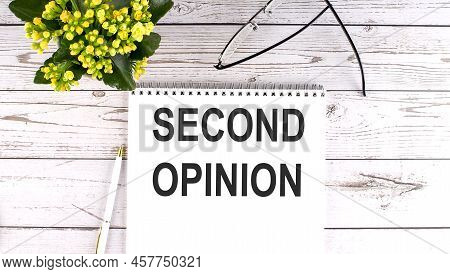 Second Opinion Text Concept Write On A Notebook On Wooden Background