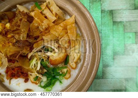 Porridge Served On Hot Claypot Topped With Chicken, Sweet Corn, Skipjack Tuna, Tofu, Green Onions, C