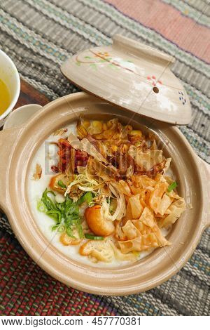 Porridge Served On Hot Claypot Topped With Chicken, Sweet Corn, Skipjack Tuna, Tofu, Green Onions, C